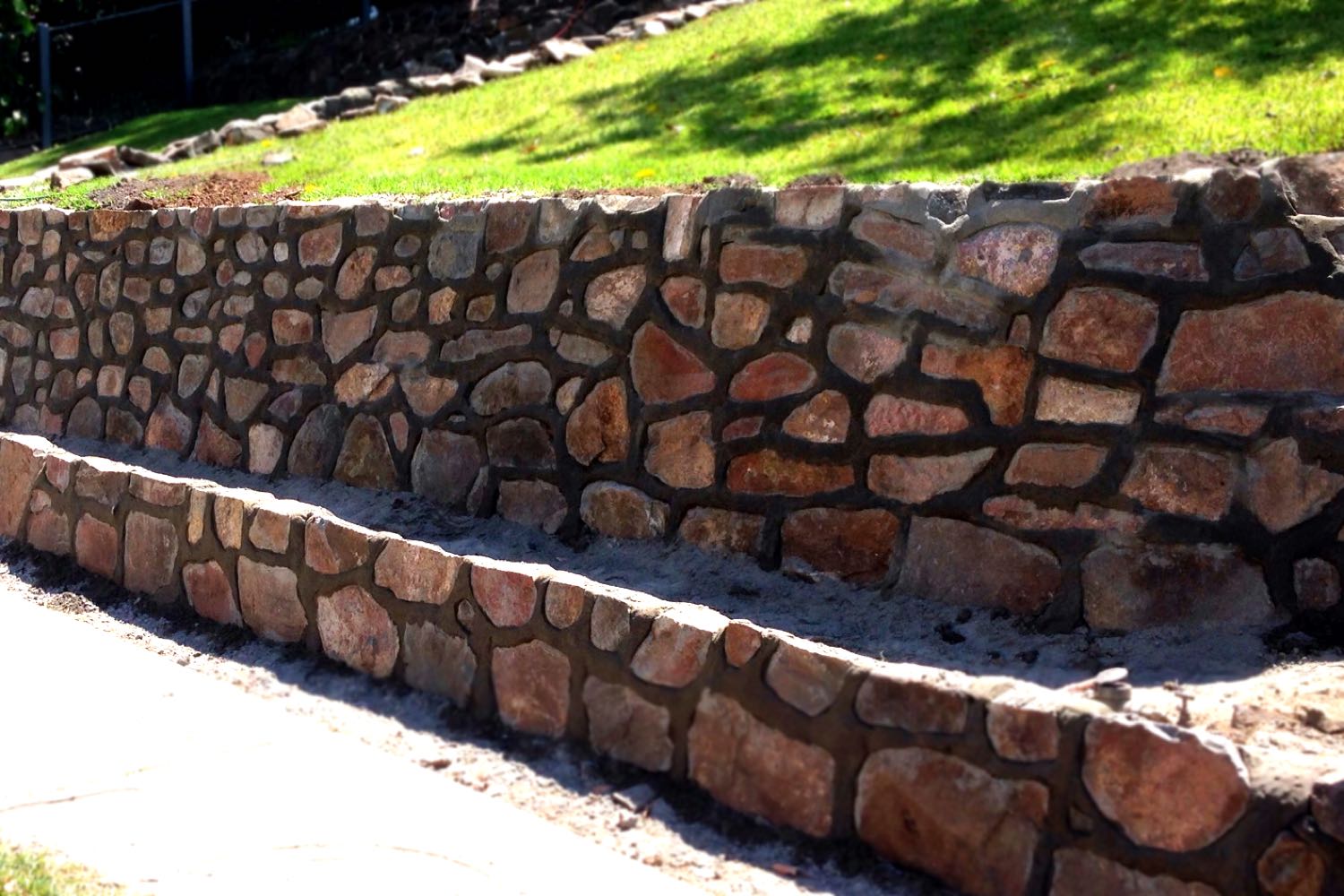 Bushrock retaining wall built by Novascape Landscaping